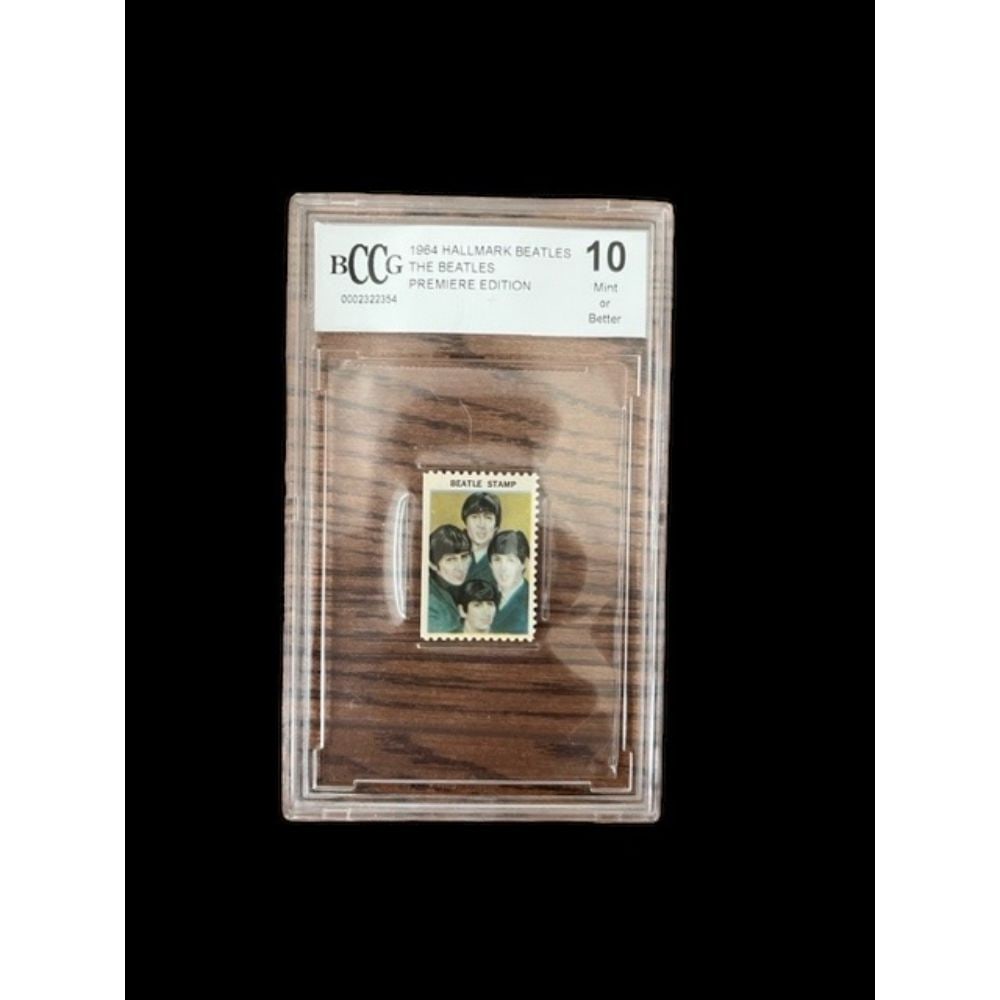 1964 Hallmark Beatles Stamp Beckett 10: This lot is a 1964 Hallmark Beatles Stamp. Beckett 10. The Beatles were an English rock band, formed in Liverpool in 1960, that comprised John Lennon, Paul McCartney, George Harrison and Ringo Starr.