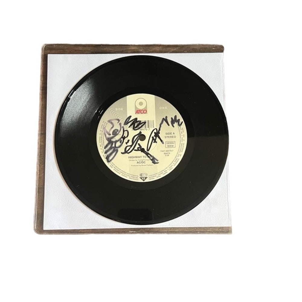 AC/DC Angus Young Signed Vinyl 45 Single: This lot is a vinyl 45 single 'Highway To Hell' autographed on the centre label of the record in black sharpie pen by Angus Young of AC/DC.