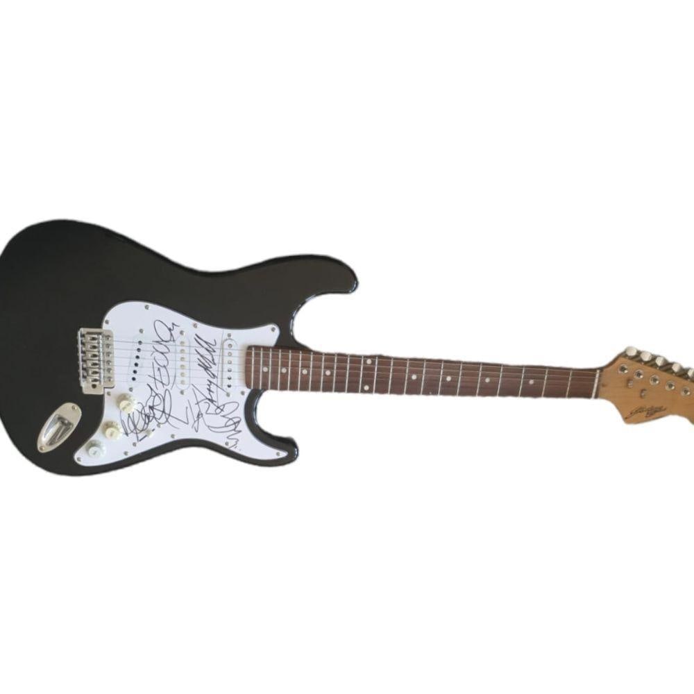 U2 Fully Signed Electric Guitar Certified: This lot is an electric guitar autographed by Bono, The Edge, Larry Mullen Jr and Adam Clayton of U2. Item comes with Certificate of Authenticity, guaranteeing it for a lifetime.