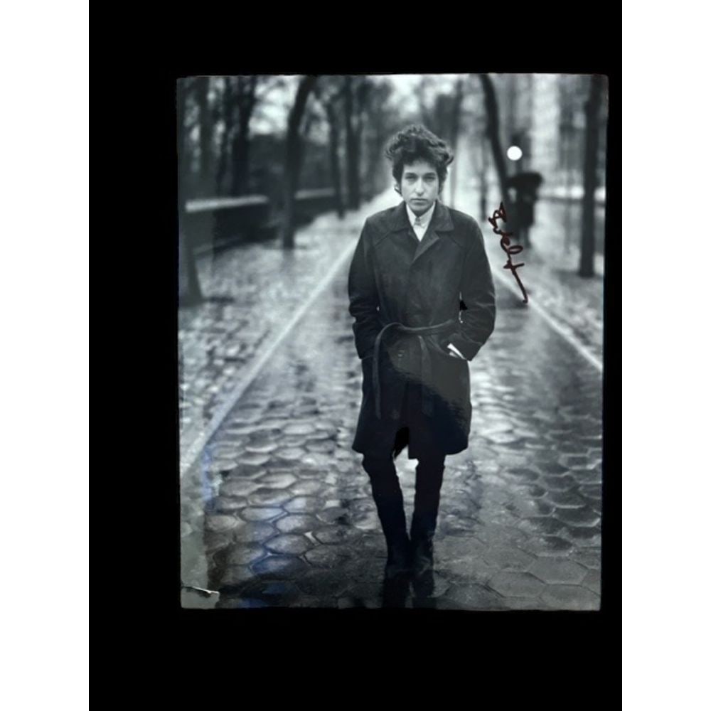 Bob Dylan Signed 8 x 10" Photograph: This lot is a 10 x 8" photograph of Bob Dylan autographed by Bob Dylan. Bob Dylan (legally Robert Dylan, born Robert Allen Zimmerman, May 24, 1941) is an American singer-songwriter. Often regarded as