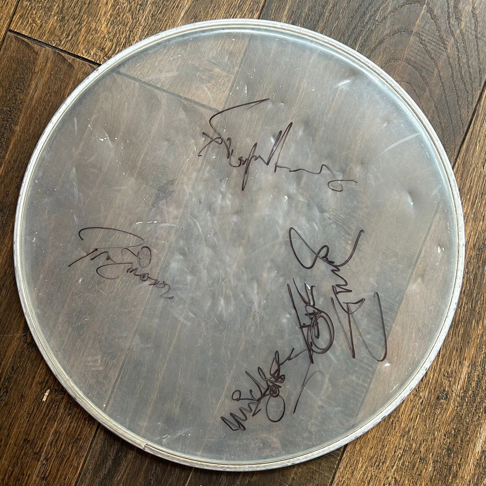 The Clash Signed Drum Skin: This lot is a drum skin autographed by Joe Strummer, Mick Jones, Paul Simonon and Topper Headdon of The Clash. Item is authenticated by HSA and comes with affixed HSA Tamper-Proof hologram with intera