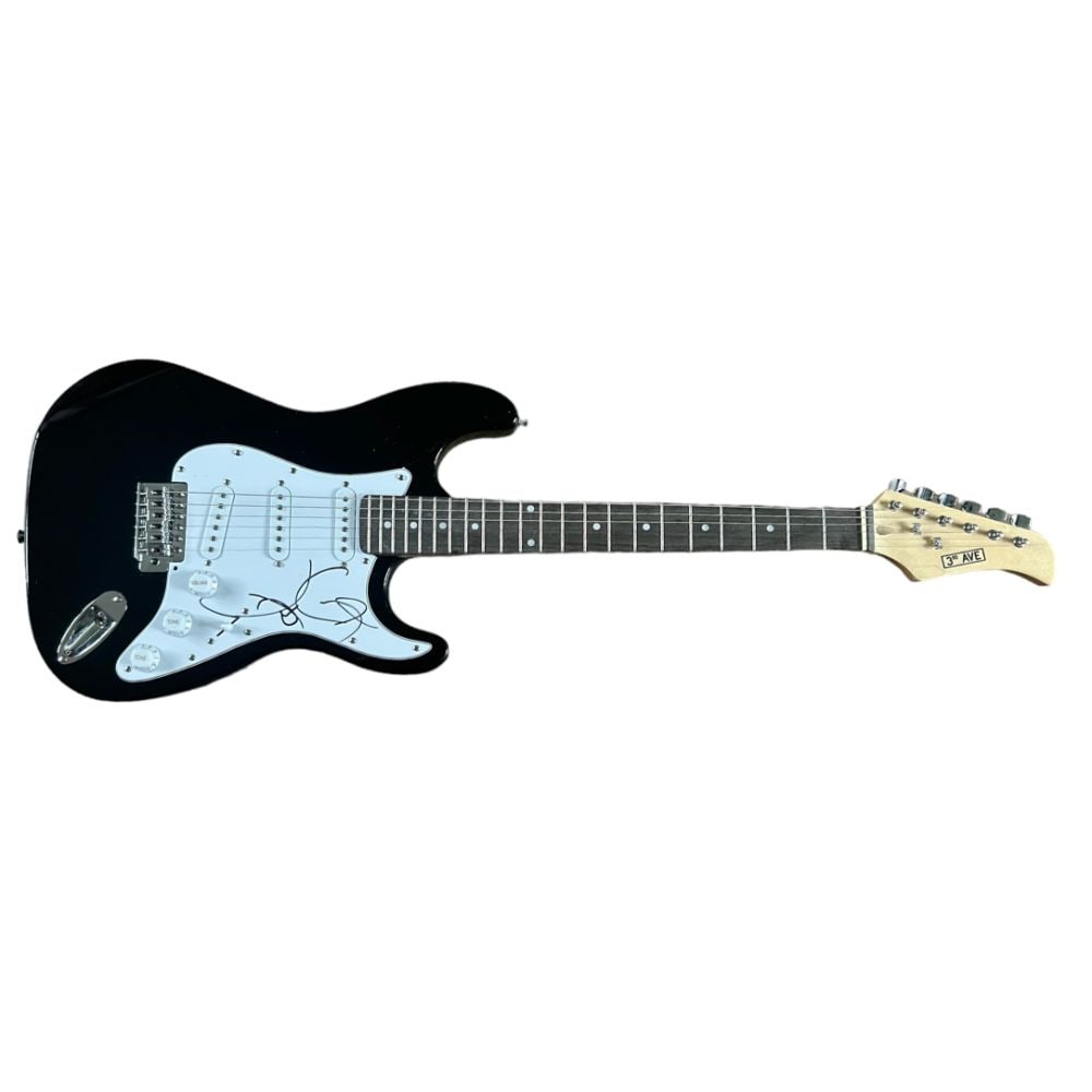 Lady Gaga Signed Electric Guitar: This lot is a black Stratocaster style guitar autographed on the pickguard by Lady Gaga. Stefani Joanne Angelina Germanotta born March 28, 1986), known professionally as Lady Gaga, is an American sing