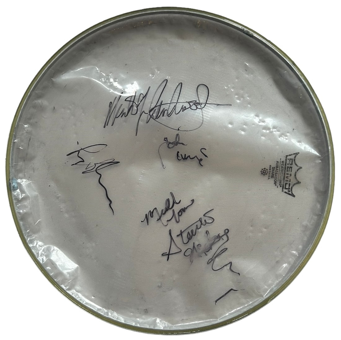 Fleetwood Mac Signed Drumskin: This lot is a 14.5" Remo drumskin, autographed in black sharpie pen by Mick Fleetwood, Lindsey Buckingham, John McVie and Stevie Nicks of Fleetwood Mac. Item comes with Certificate of Authenticity, gu