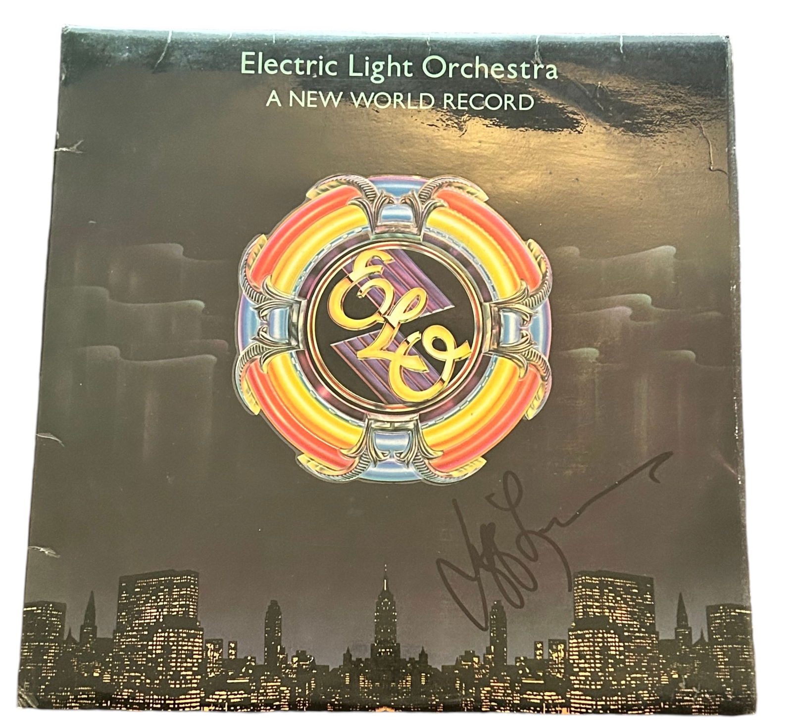 Jeff Lynne ELO Signed A New World Record Vinyl LP #2: This lot is a vinyl LP (A New World Record) autographed on the front cover in black sharpie pen by Jeff Lynne. Item comes with Certificate of Authenticity, guaranteeing it for a lifetime.
