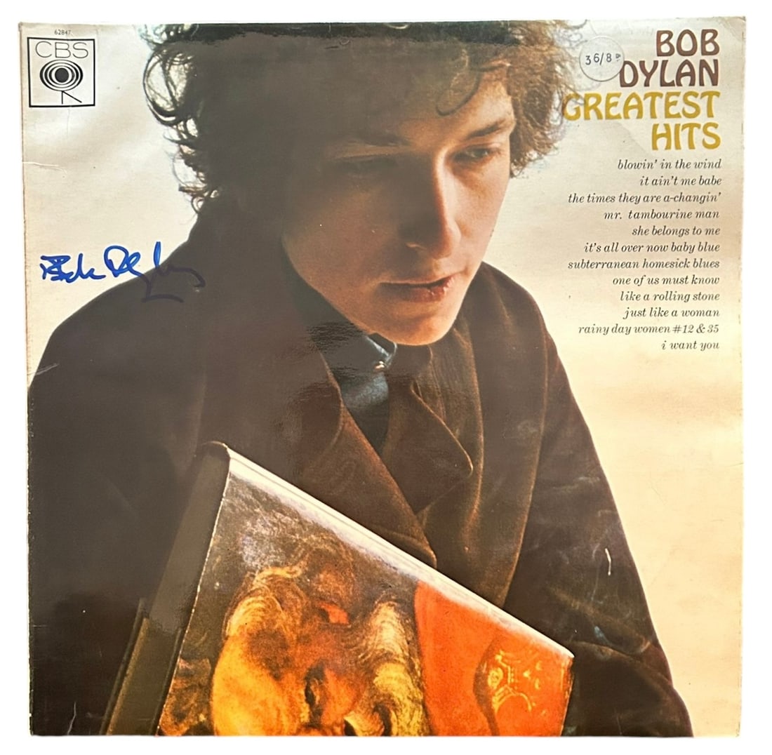 Bob Dylan Signed Greatest Hits Vinyl LP: This lot is a vinyl LP (Greatest Hits) autographed on the front cover in blue sharpie pen by Bob Dylan. Item comes with Certificate of Authenticity, guaranteeing it for a lifetime.