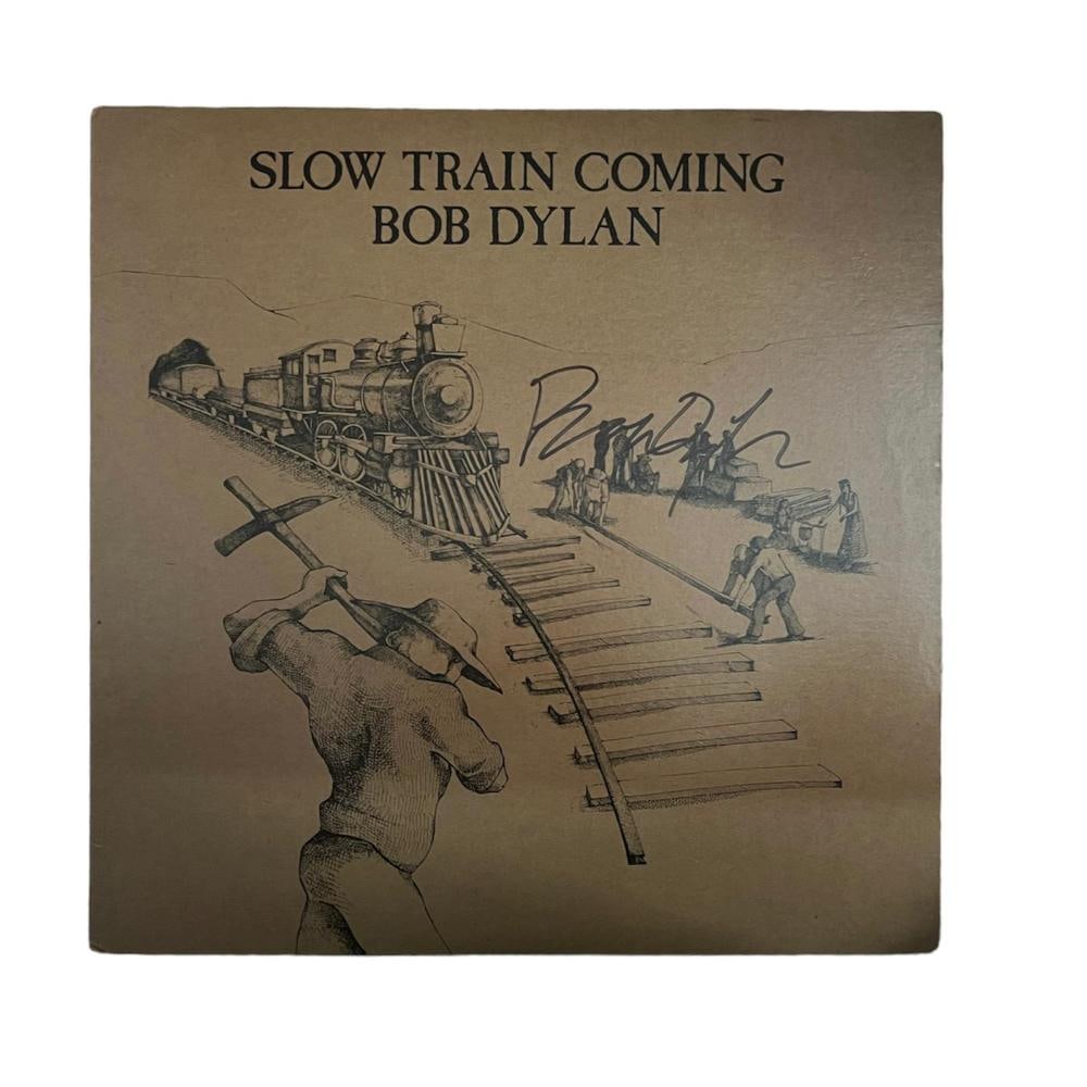 Bob Dylan Signed Slow Train Coming Vinyl LP: This lot is a vinyl LP Slow Train Coming, autographed by Bob Dylan. Item comes with Certificate of Authenticity, guaranteeing it for a lifetime.