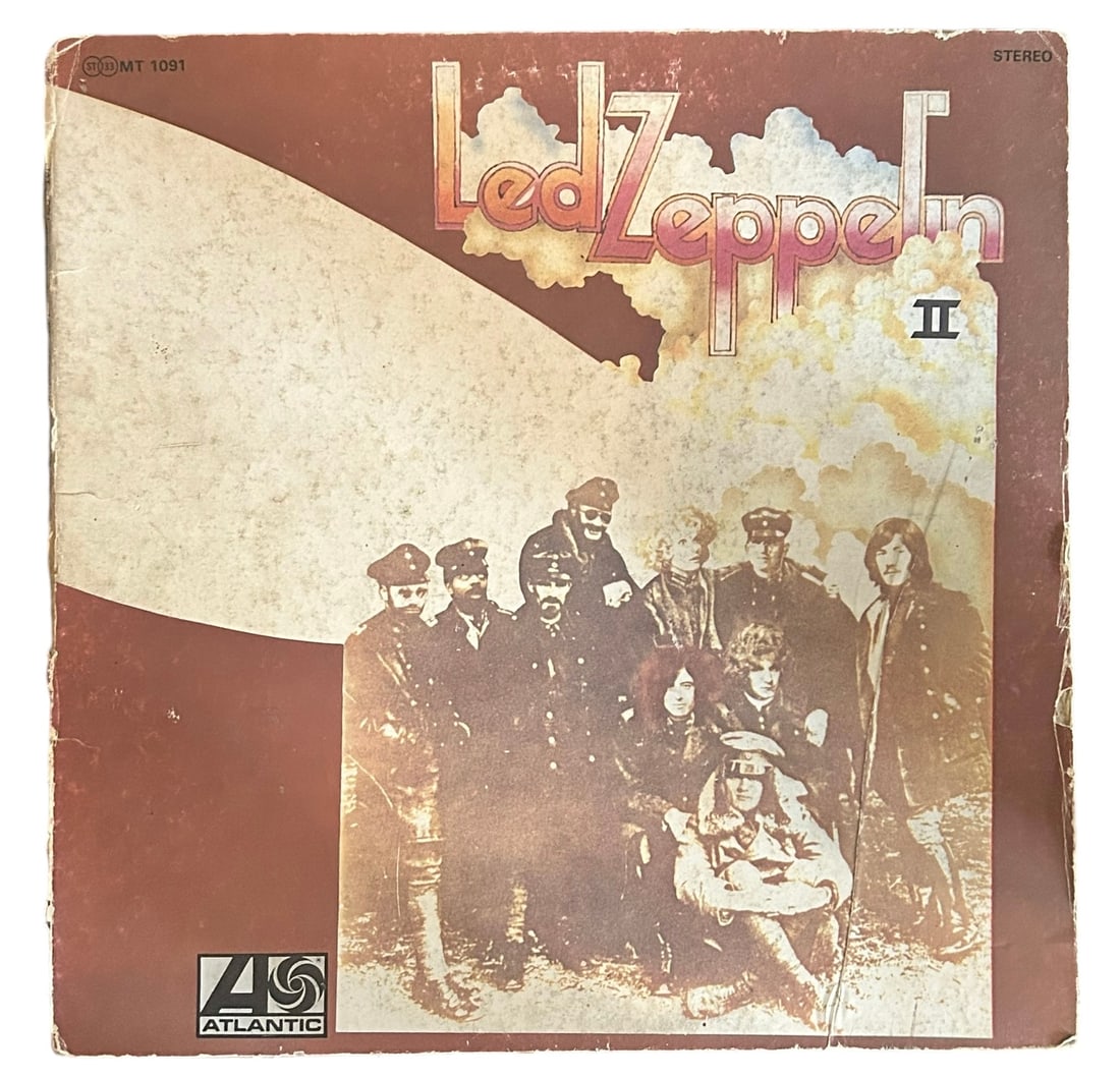 Led Zeppelin II Signed Vinyl LP: This lot is a vinyl LP (Led Zeppelin II) autographed on the inside covers in black sharpie pen by Robert Plant, Jimmy Page, Jason Bonham and John Paul Jones of Led Zeppelin. Item comes with Certificat