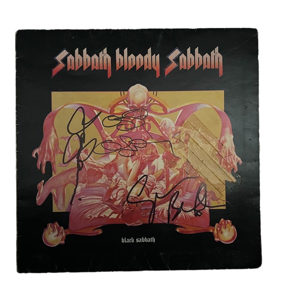 Black Sabbath Signed Sabbath Bloody Sabbath Vinyl LP: This lot is a vinyl LP Sabbath Bloody Sabbath, autographed by Ozzy Osbourne, Toni Iommi and Geezer Butler of Black Sabbath. Item comes with Certificate of Authenticity, guaranteeing it for a lifetime.