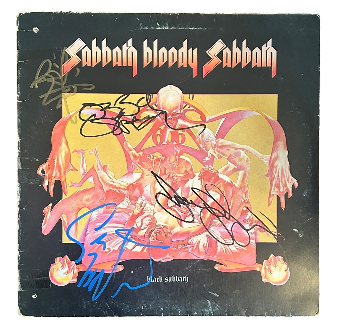 Black Sabbath Signed Vinyl LP: This lot is a vinyl LP (Sabbath Bloody Sabbath) autographed on the front cover by Ozzy Osbourne, Geezer Butler, Tony Iommi and Bill Ward of Black Sabbath.