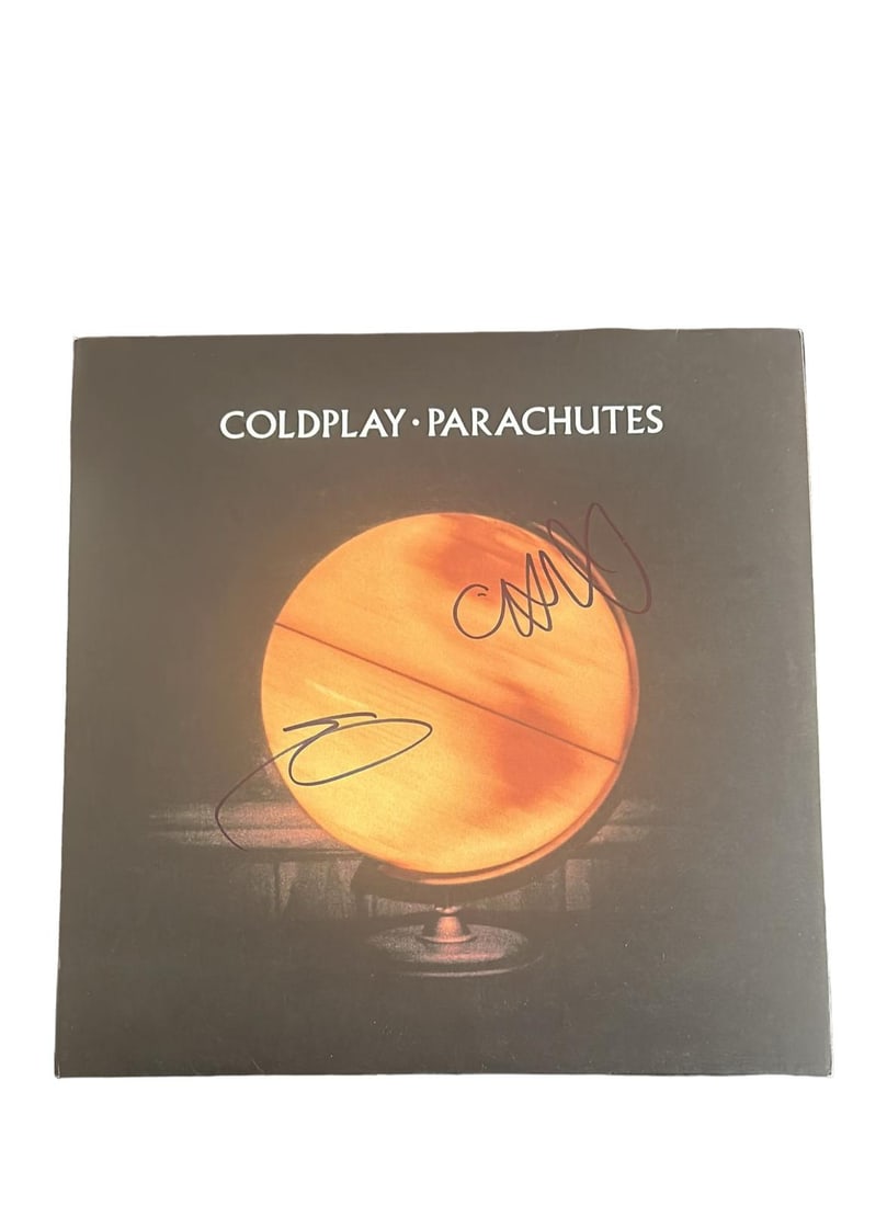 Coldplay Signed Parachutes Vinyl LP: This lot is a vinyl LP (Parachutes) autographed by Chris Martin and Guy Berryman of Coldplay. Item comes with Certificate of Authenticity, guaranteeing it for a lifetime.