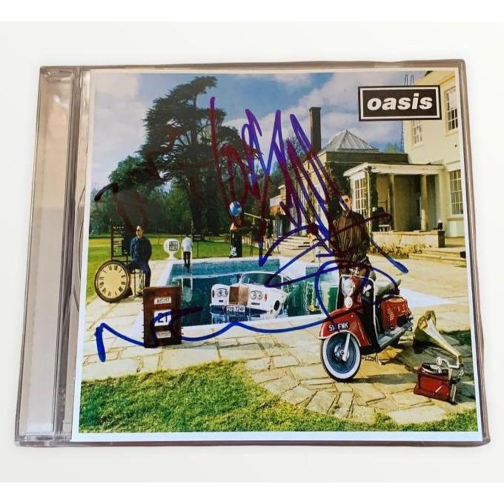Oasis Be Here Now Signed CD Certified: This lot is a CD (Be Here Now) autographed by Noel Gallagher, Liam Gallagher and Bonehead of Oasis. Item comes with Certificate of Authenticity, guaranteeing it for a lifetime.
