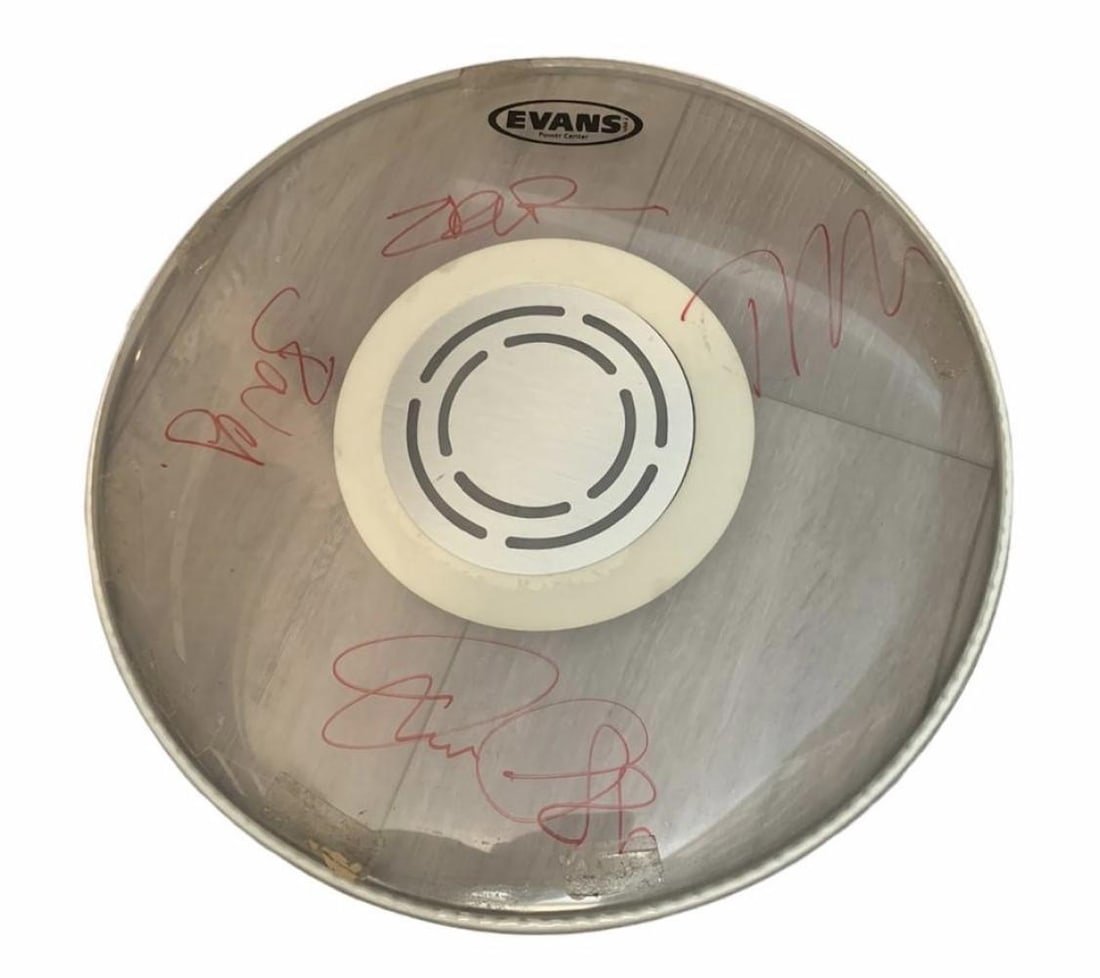 Rage Against The Machine Signed Drumskin Certified: This lot is a drumskin autographed by Zack de la Rocha, Tom Morello, Brad Wilk and Tim Commerford of Rage Against the Machine. Item comes with Certificate of Authenticity, guaranteeing it for a lifeti
