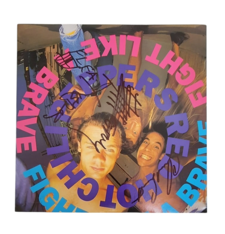 Red Hot Chilli Peppers Signed Vinyl LP: This lot is a vinyl LP (Fight Like A Brave), autographed by Chad Smith, Anthony Kiedis, John Frusciante and Flea of Red Hot Chilli Peppers. Item comes with third-party authentication and affixed tampe