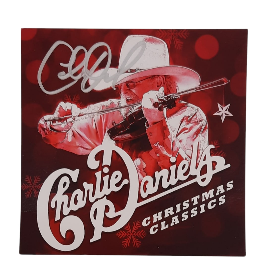Charlie Daniels Signed Album Art Card: This lot is an album art card only (Christmas classics), autographed by Charlie Daniels. Item comes with third-party authentication and affixed tamper-proof holographic QR sticker leading to item deta