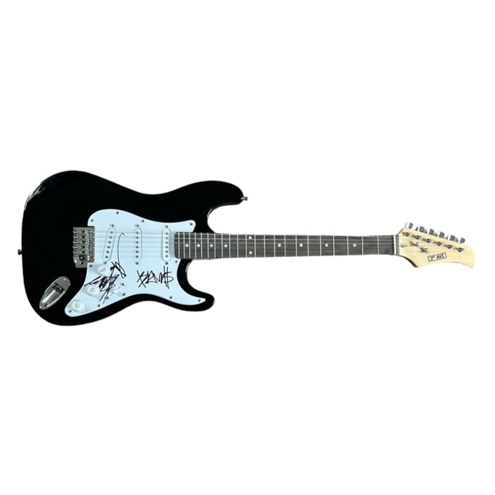 Blink 182 Fully Signed Electric Guitar: This lot is a black Stratocaster style electric guitar autographed on the pickguard by Mark Hoppus, Tom Delonge and Travis Barker of Blink 182. Blink-182 (stylized as blink-182) is an American rock ba