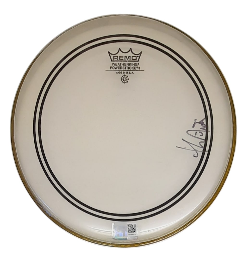 Radiohead Signed Drumskin: This lot is a 10.5" Remo drumskin, autographed by Thom Yorke of Radiohead. Item comes with third-party authentication and affixed tamper-proof holographic QR sticker leading to item details and scorin