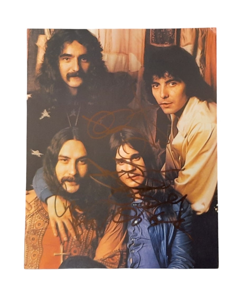 Black Sabbath Signed Photograph: This lot is an 8x10" photograph, autographed by Ozzy Osbourne, Geezer Butler, Bill Ward and Tony Iommi of Black Sabbath. Item comes with third-party authentication and affixed tamper-proof holographic