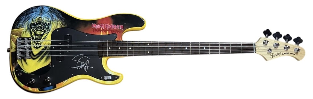 Steve Harris Signed Iron Maiden Custom Graphics Bass Guitar AFTAL Authentication: This lot is a bass guitar with a custom Iron Maiden artwork graphic body, autographed on the pickguard by Steve Harris of Iron Maiden. Item comes with third-party authentication from AFTAL and affixed