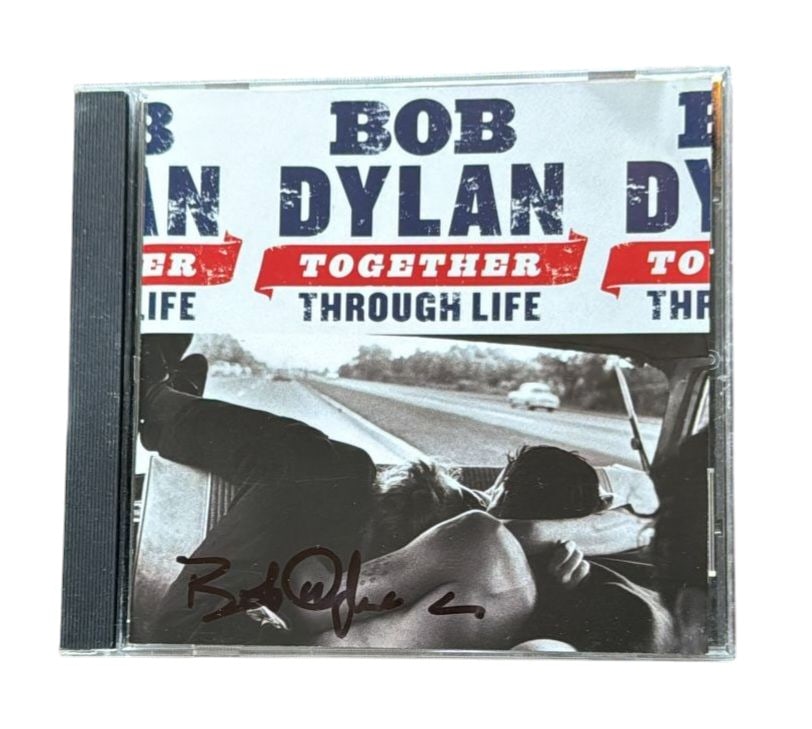 Bob Dylan Signed CD: This lot is a CD (Together Through Life), autographed on the front of the CD sleeve by Bob Dylan. Item comes with third-party authentication and affixed tamper-proof holographic QR sticker leading to