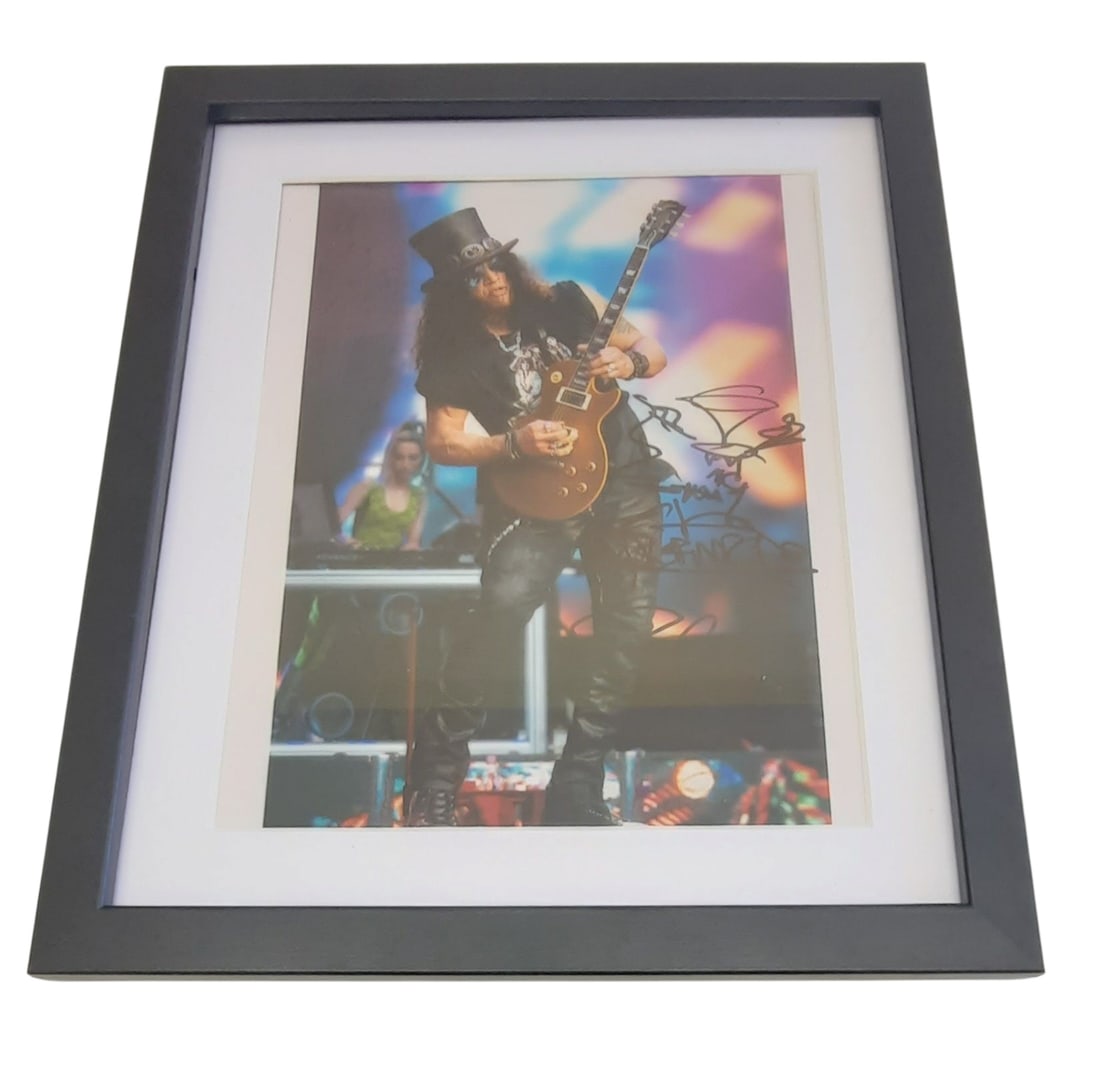 Slash Guns N' Roses Signed Framed Photograph: This lot is a framed 8x10" photograph, autographed by Slash of Guns N' Roses. The photo is housed within a mounted black wooden frame, an ideal display item for collectors. Item comes with third-party