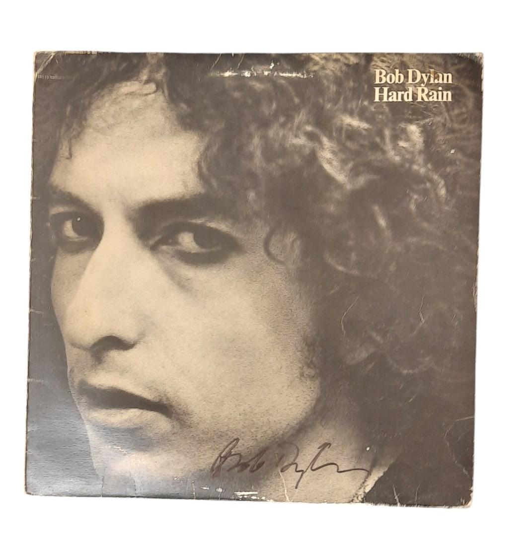 Bob Dylan Signed Vinyl LP: This lot is a vinyl LP (Hard Rain) autographed by Bob Dylan. Item comes with third-party authentication and affixed tamper-proof holographic QR sticker leading to item details and scoring.