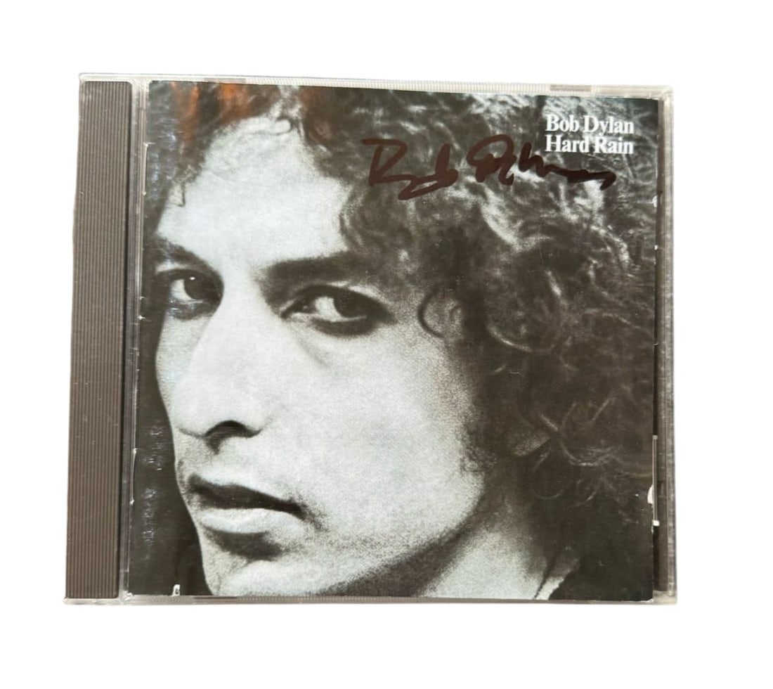 Bob Dylan Signed CD: This lot is a CD (Hard Rain), autographed on the front of the CD sleeve by Bob Dylan. Item comes with third-party authentication and affixed tamper-proof holographic QR sticker leading to item details