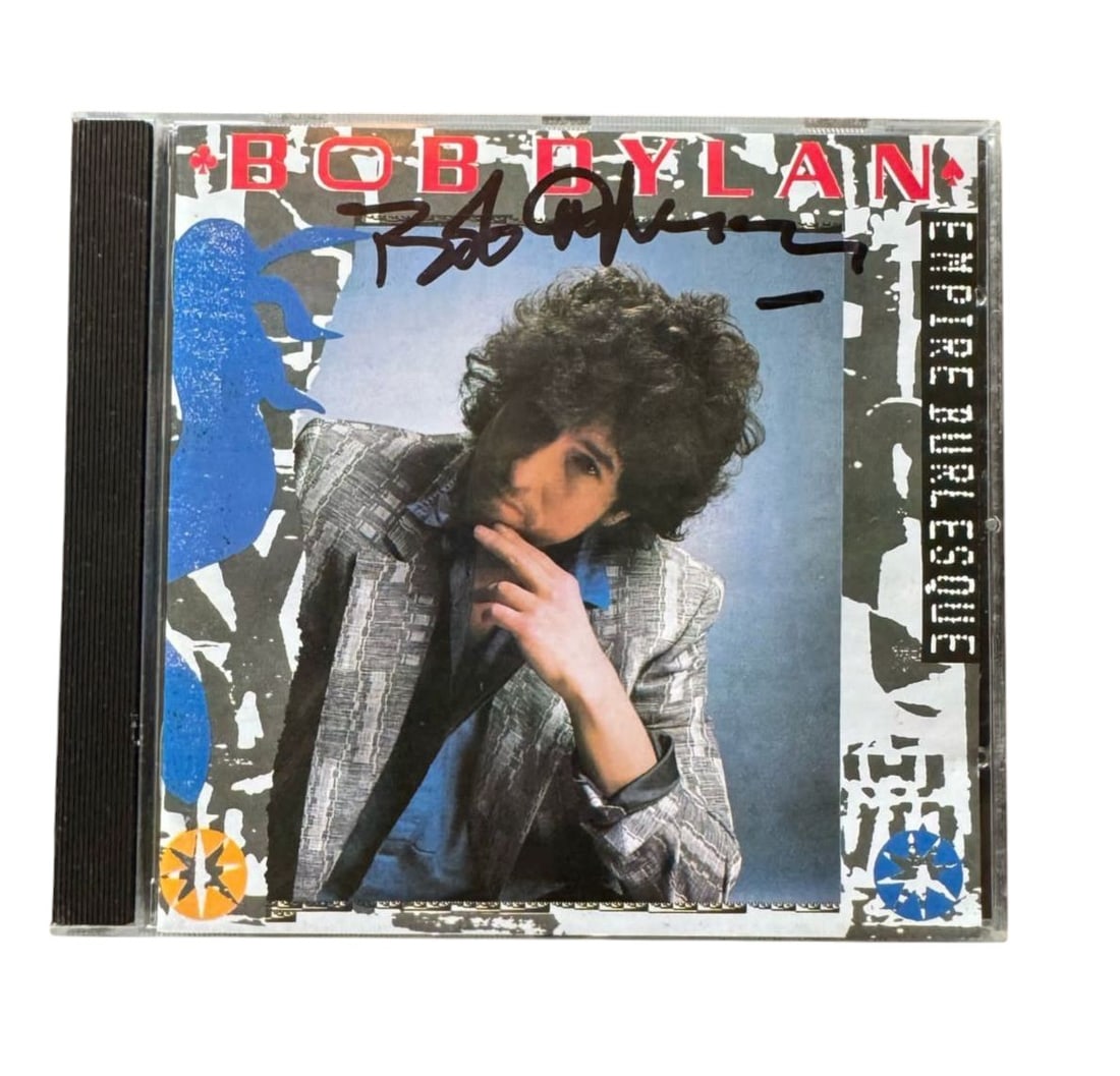 Bob Dylan Signed CD: This lot is a CD (Empire Burlesque), autographed on the front of the CD sleeve by Bob Dylan. Item comes with third-party authentication and affixed tamper-proof holographic QR sticker leading to item
