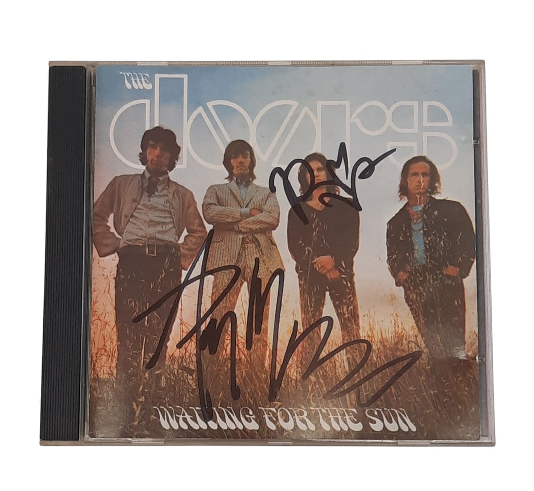 The Doors Signed CD: This lot is a CD (Waiting For The Sun), autographed on the front of the CD sleeve by Ray Manzarek and Robby Krieger of The Doors. Item comes with third-party authentication and affixed tamper-proof ho