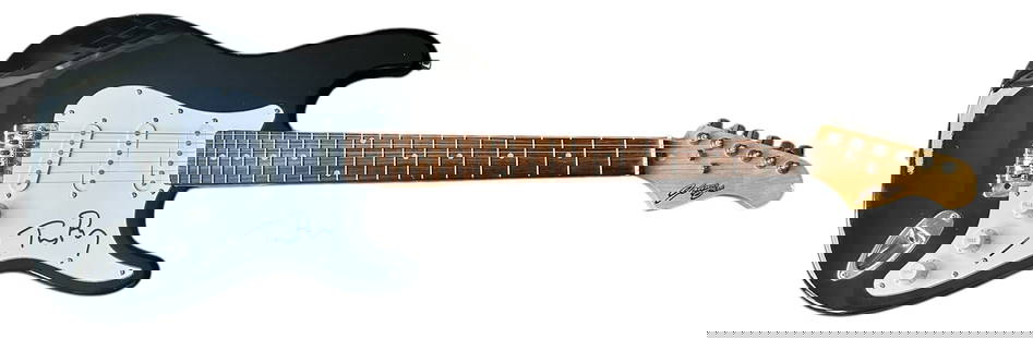 Tom Petty Signed Electric Guitar: This lot is an electric guitar, autographed on the pickguard by Tom Petty. Item comes with third-party authentication and affixed tamper-proof holographic QR sticker leading to item details and scorin