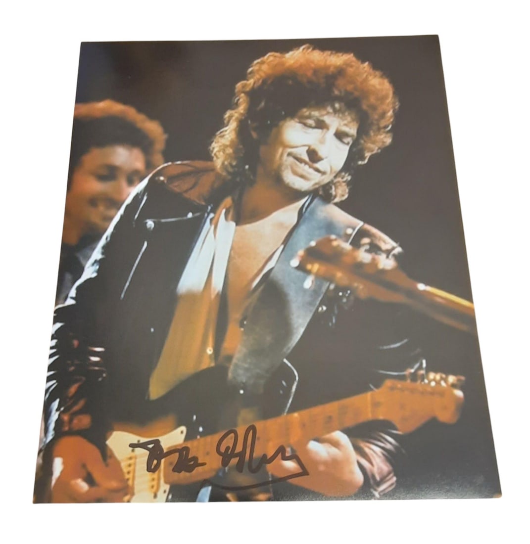 Bob Dylan Signed Photograph: This lot is an 8x10" photograph, autographed by Bob Dylan. Item comes with third-party authentication and affixed tamper-proof holographic QR sticker leading to item details and scoring.