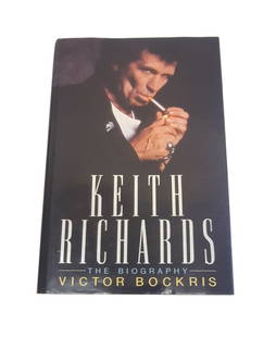 Keith Richards Signed Book: This lot is a book (Keith Richards The Biography), autographed on the inside page by Keith Richards. Item comes with third-party authentication and affixed tamper-proof holographic QR sticker leading