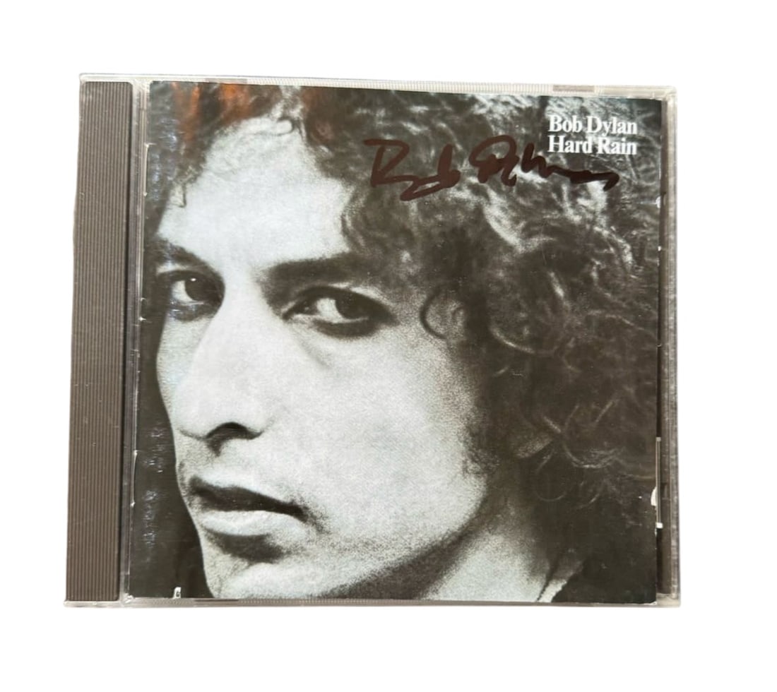 Bob Dylan Signed CD: This lot is a CD (Hard Rain), autographed on the front of the CD sleeve by Bob Dylan. Item comes with third-party authentication and affixed tamper-proof holographic QR sticker leading to item details