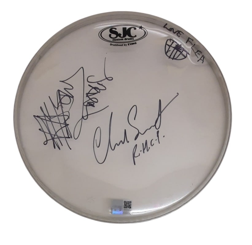 Red Hot Chili Peppers Signed Drumskin: This lot is a 12.5" Evans/SJC drumskin, autographed by Flea, Chad Smith, Anthony Kiedis and John Frusciante of Red Hot Chili Peppers. Item comes with third-party authentication and affixed tamper-proo