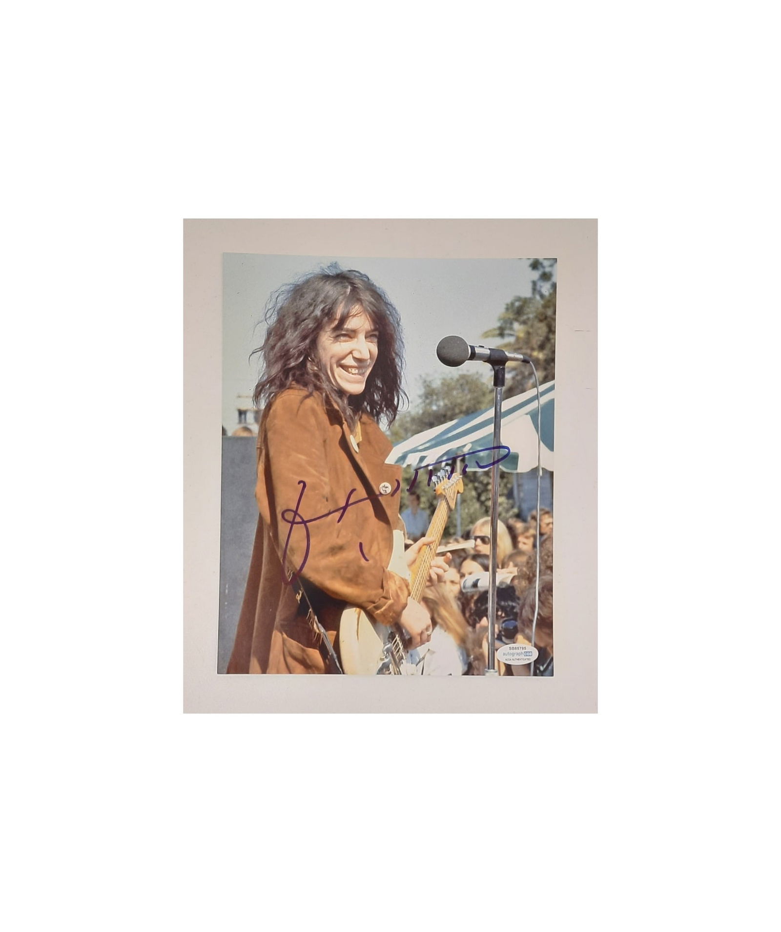 Patti Smith Signed Photograph: This lot is an 8x10" photograph, autographed by Patti Smith. Item comes with third-party authentication and affixed tamper-proof holographic QR sticker leading to item details and scoring.