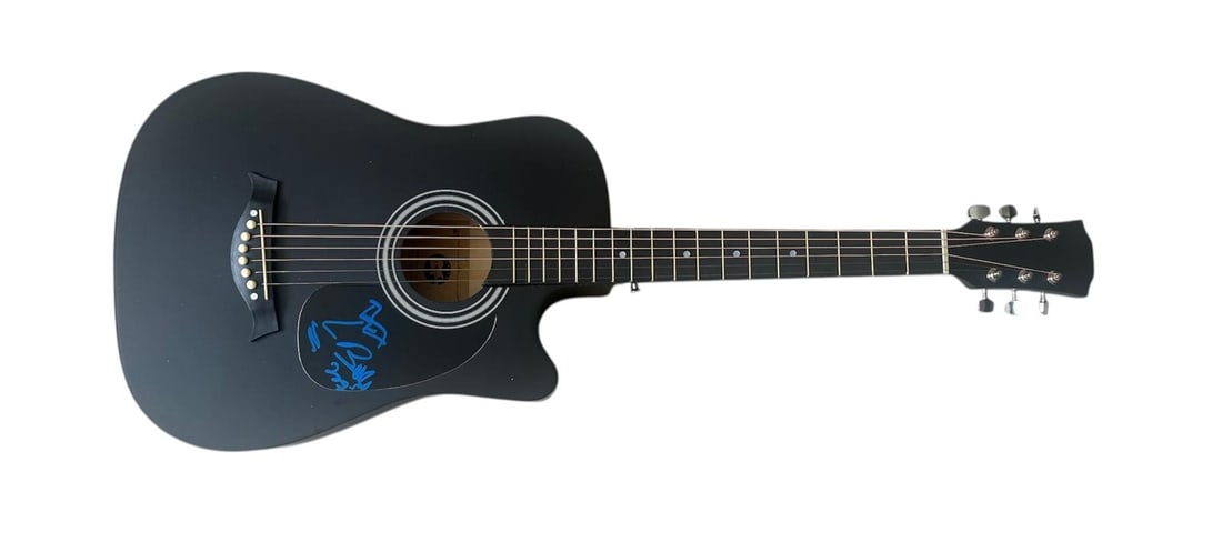 U2 Bono Signed Acoustic Guitar: This lot is an acoustic guitar, autographed on the plate by Bono of U2. Item comes with third-party authentication and affixed tamper-proof holographic QR sticker leading to item details and scoring.