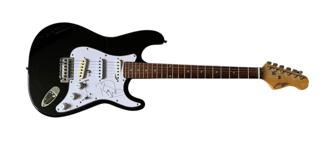 Queen Signed Electric Guitar: This lot is an electric guitar, autographed on the pickguard by Brian May, Roger Taylor and Adam Lambert of Queen. Item comes with third-party authentication and affixed tamper-proof holographic QR st