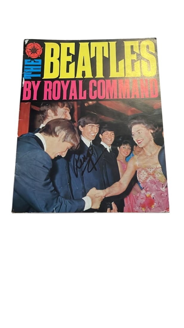 The Beatles Signed Booklet: This lot is a booklet (The Beatles By Royal Command - 1963 Daily Mirror Publication), autographed on the front cover by Ringo Starr of the Beatles. Item comes with third-party authentication and affix