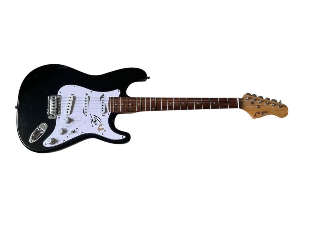 The Beatles Signed Electric Guitar: This lot is an electric guitar, autographed on the pickguard by Paul McCartney, Ringo Starr and Yoko Ono of The Beatles. Item comes with third-party authentication and affixed tamper-proof holographic