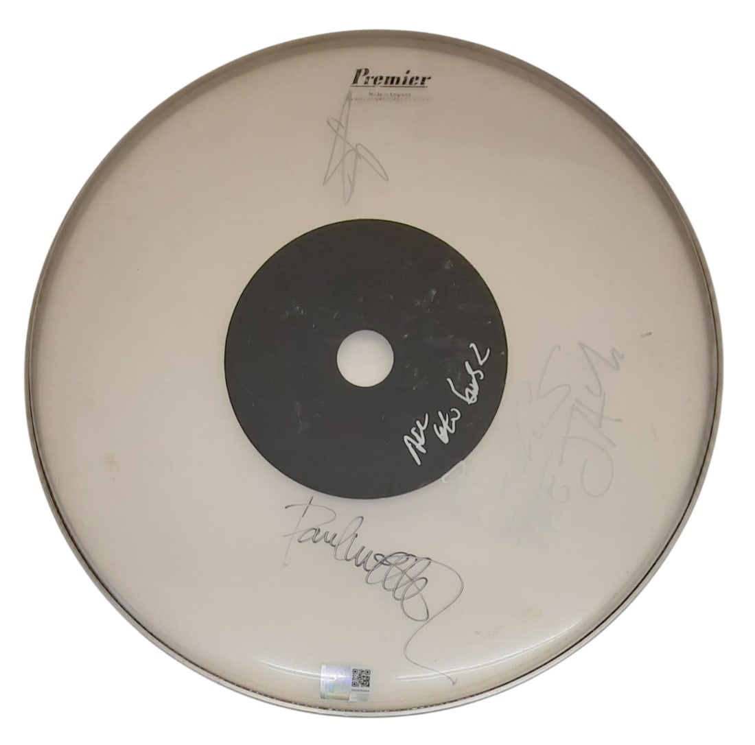 The Jam Signed Drumskin: This lot is a 16.5" Premier drumskin, autographed by Paul Weller, Bruce Foxton and Rick Buckler of The Jam. Item comes with third-party authentication and affixed tamper-proof holographic QR sticker l