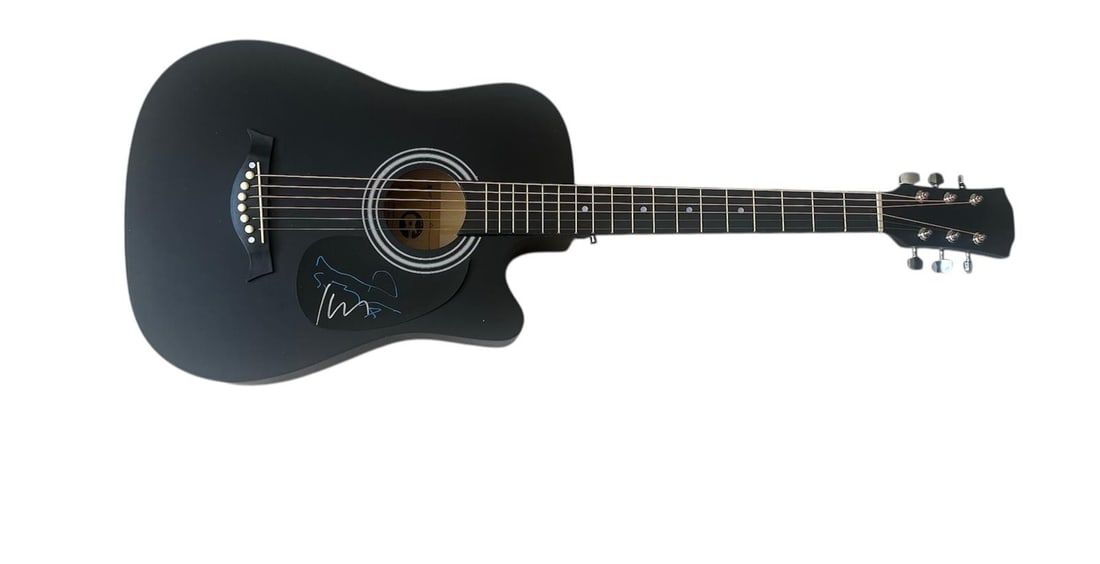 Oasis Signed Acoustic Guitar: This lot is an acoustic guitar, autographed on the plate by Noel Gallagher and Liam Gallagher of Oasis. Item comes with third-party authentication and affixed tamper-proof holographic QR sticker leadi