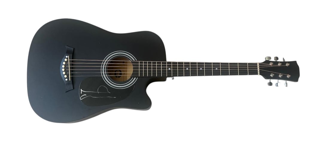 Oasis Noel Gallagher Signed Acoustic Guitar: This lot is an acoustic guitar, autographed on the plate by Noel Gallagher of Oasis. Item comes with third-party authentication and affixed tamper-proof holographic QR sticker leading to item details