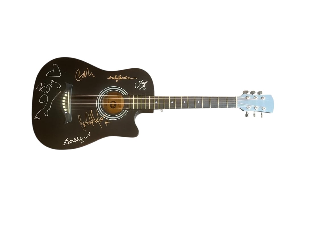 Oasis Signed Acoustic Guitar: This lot is an acoustic guitar, autographed on the body by Noel Gallagher, Liam Gallagher, Gem Archer, Andy Bell, Bonehead and Joey Waronker of Oasis. Item comes with third-party authentication and af