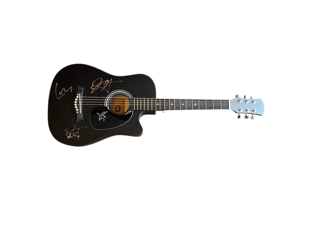 Metallica Signed Acoustic Guitar: This lot is an acoustic guitar, autographed on the body by James Hetfield, Kirk Hammett, Lars Ulrich and Robert Trujillo of Metallica. Item comes with third-party authentication and affixed tamper-pro
