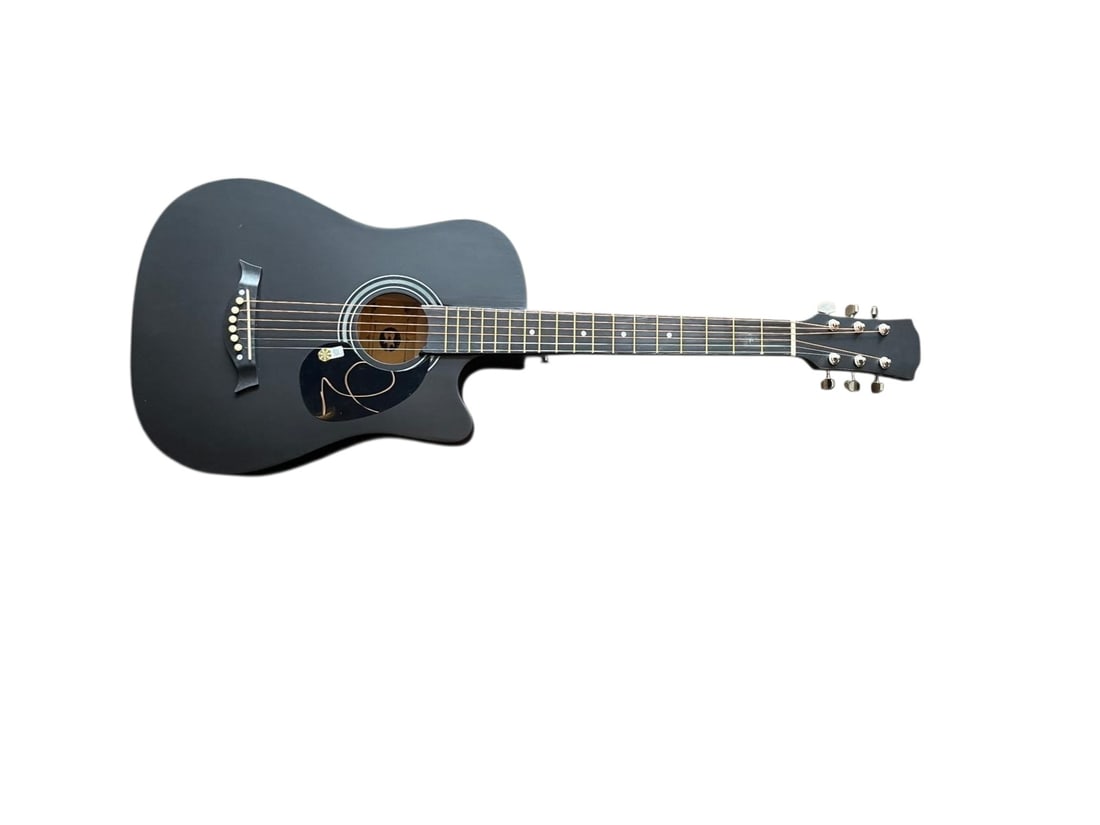 Oasis Noel Gallagher Signed Acoustic Guitar: This lot is an acoustic guitar, autographed on the body by Noel Gallagher of Oasis. Item comes with third-party authentication and affixed tamper-proof holographic QR sticker leading to item details a