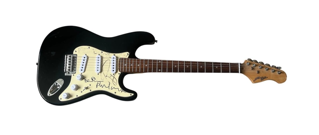 Pink Floyd Signed Electric Guitar: This lot is an electric guitar, autographed on the pickguard by Roger Waters, Nick Mason, David Gilmour and Richard Wright of Pink Floyd. The autographs of Nick Mason and Roger Waters are faded/smudge