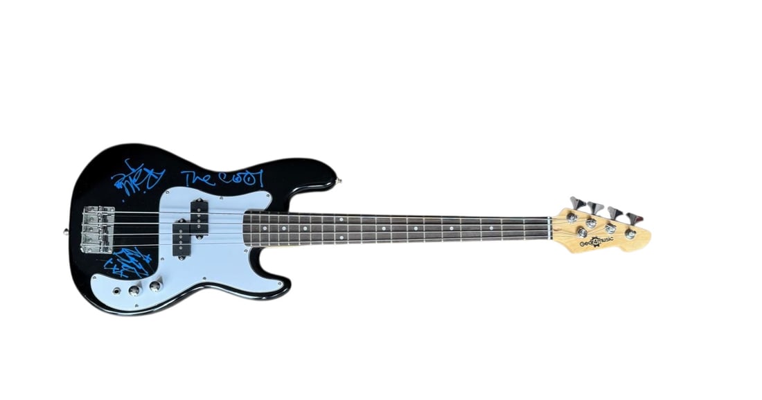 Green Day Signed Bass Guitar: This lot is a Bass guitar, autographed on the body in blue sharpie pen by Tre Cool, Billy Joe Armstrong and Mike Dirnt of Green Day. Item comes with third-party authentication and affixed tamper-proof
