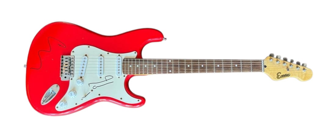 Oasis Signed Electric Guitar: This lot is an electric guitar, autographed on the body by Liam Gallagher and on the pickguard by Noel Gallagher of Oasis. Item is authenticated by HSA and comes with affixed HSA Tamper-Proof hologram