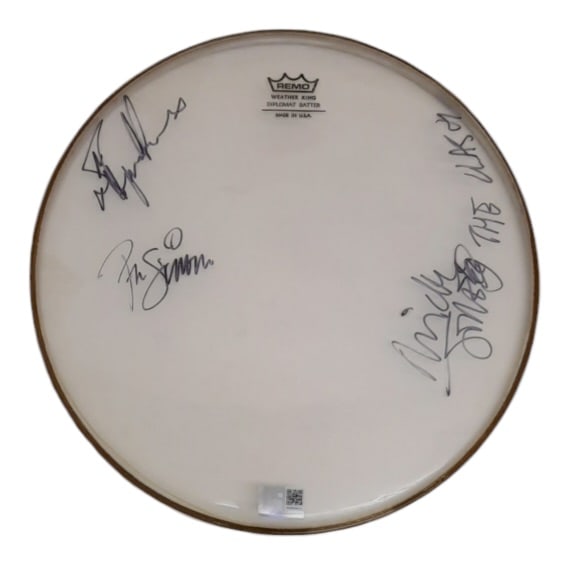 The Clash Signed Drumskin: This lot is a 13.5" Remo drumskin, autographed by Mick Jones, Paul Simonon and Topper Headon of The Clash. Item comes with third-party authentication and affixed tamper-proof holographic QR sticker le