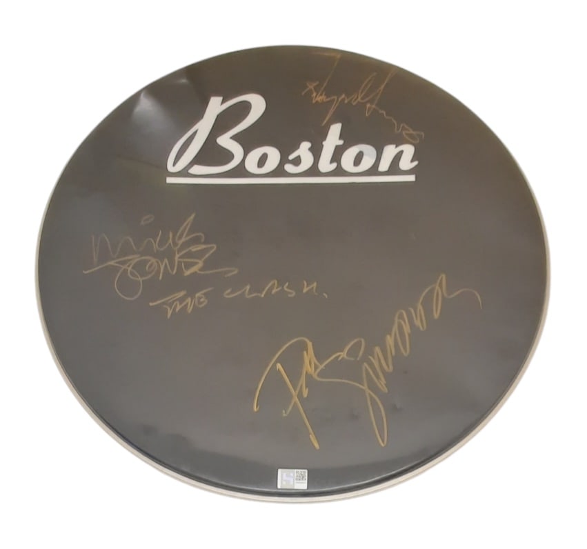 The Clash Signed Drumskin: This lot is a 22.5" Boston bass drumskin, autographed by Mick Jones, Paul Simonon and Topper Headon of The Clash. Item comes with third-party authentication and affixed tamper-proof holographic QR sti
