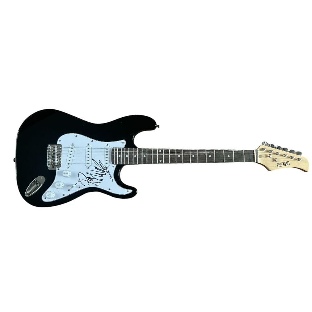 Roger Waters Pink Floyd Signed Electric Guitar: This lot is a black Stratocaster style guitar autographed on the pickguard by Roger Waters of Pink Floyd. Pink Floyd are an English rock band formed in London in 1965. Gaining an early following as on